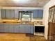 Kitchen with cabinetry, sink, and aged oven at 112 Greenwood Ave, Belmont, NC 28012