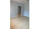 Bright bedroom with wood-look floors, neutral paint, and ceiling fan at 1121 Myrtle Ave # 58, Charlotte, NC 28203