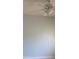 Neutral paint, wood floor, and a ceiling fan create a soothing atmosphere in this comfortable bedroom at 1121 Myrtle Ave # 58, Charlotte, NC 28203
