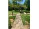 Community grounds featuring well-maintained sidewalks and mature landscaping at 1121 Myrtle Ave # 58, Charlotte, NC 28203