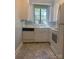 The kitchen features a window with natural light at 1121 Myrtle Ave # 58, Charlotte, NC 28203