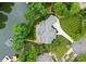 Aerial view of luxury home with pool, lawns, and dock at 116 Creeky Hollow Dr, Mooresville, NC 28117