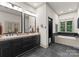 Beautiful bathroom suite featuring dual sinks, soaking tub and walk-in shower at 116 Creeky Hollow Dr, Mooresville, NC 28117