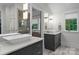 Sleek bathroom design with dual vanities, stylish lighting, and a glass-enclosed shower for a spa-like feel at 116 Creeky Hollow Dr, Mooresville, NC 28117