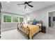 Comfortable bedroom with a ceiling fan and a sunny window for natural light at 116 Creeky Hollow Dr, Mooresville, NC 28117