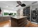 Custom closet includes ample storage, an island with drawers, and a washer/dryer for added convenience at 116 Creeky Hollow Dr, Mooresville, NC 28117