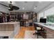 Spacious closet with custom organizers, storage, and hardwood floors. A desk area and natural light enhance functionality at 116 Creeky Hollow Dr, Mooresville, NC 28117