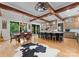 Large kitchen featuring a central island, wooden beams, and an adjacent dining area at 116 Creeky Hollow Dr, Mooresville, NC 28117