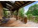 Expansive outdoor deck with comfortable seating, ceiling fan and built in outdoor grill at 116 Creeky Hollow Dr, Mooresville, NC 28117