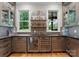 Charming wet bar featuring custom cabinets, mosaic tile backsplash, and beverage coolers at 116 Creeky Hollow Dr, Mooresville, NC 28117