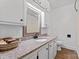 Bathroom featuring granite countertops, white cabinets, and white walls at 118 Cabarrus W Ave, Concord, NC 28025