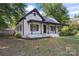Charming home featuring a welcoming porch and meticulously maintained front yard at 118 Cabarrus W Ave, Concord, NC 28025