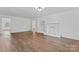 Bright, neutral living room featuring new floors, fresh paint, built-in shelving and a window at 118 Cabarrus W Ave, Concord, NC 28025