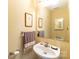 Simple and functional bathroom with a clean sink, large mirror, and neutral decor at 123 Singleton Rd, Mooresville, NC 28117