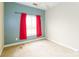 Bedroom with neutral walls, carpet, and a window with bright red curtains at 123 Singleton Rd, Mooresville, NC 28117
