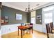 Elegant dining room with hardwood floors, a chandelier, and natural light from the window at 123 Singleton Rd, Mooresville, NC 28117