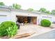 Attached garage with storage, work table, and standard garage door at 123 Singleton Rd, Mooresville, NC 28117