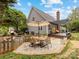 Charming backyard with a stone patio, fire pit, and a spacious deck for outdoor entertaining at 15313 Moate Ct, Huntersville, NC 28078