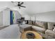 Versatile bonus room featuring a gray sectional couch, workstation, and neutral walls at 15313 Moate Ct, Huntersville, NC 28078