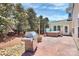 An outdoor grill and hot tub on a stone patio provides relaxing entertainment in the backyard at 1618 Bay Meadows Nw Ave, Concord, NC 28027