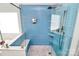 Modern bathroom with a glass-enclosed shower and separate tub with blue tiles at 1618 Bay Meadows Nw Ave, Concord, NC 28027
