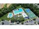 Aerial of the neighborhood includes a pool, tennis courts, playground, and clubhouse at 1618 Bay Meadows Nw Ave, Concord, NC 28027