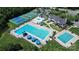 Aerial view of the community pool with waterslides, tennis courts, and recreation center at 1618 Bay Meadows Nw Ave, Concord, NC 28027