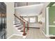 Open entryway flows into the living room and offers tile flooring and wooden stairs at 1618 Bay Meadows Nw Ave, Concord, NC 28027