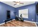 Exercise room with blue walls and exercise equipment at 1618 Bay Meadows Nw Ave, Concord, NC 28027