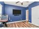 Bright exercise room with a ceiling fan and mounted television at 1618 Bay Meadows Nw Ave, Concord, NC 28027
