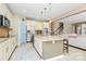 Bright kitchen features an island with granite countertops and stainless steel appliances at 1618 Bay Meadows Nw Ave, Concord, NC 28027