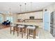 Elegant kitchen featuring a granite-topped island with barstool seating and stainless-steel appliances at 1618 Bay Meadows Nw Ave, Concord, NC 28027