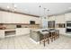 Modern kitchen with an island, offering plenty of seating and stainless-steel appliances for cooking at 1618 Bay Meadows Nw Ave, Concord, NC 28027