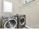 Bright laundry room with modern washer and dryer at 1618 Bay Meadows Nw Ave, Concord, NC 28027