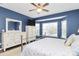 Main bedroom with white furniture and a bay window for natural light at 1618 Bay Meadows Nw Ave, Concord, NC 28027