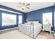 Comfortable main bedroom with a bay window, ceiling fan, and carpet at 1618 Bay Meadows Nw Ave, Concord, NC 28027