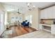 Bright sunroom with hardwood floors, skylight, fan and large windows overlooking greenery at 1618 Bay Meadows Nw Ave, Concord, NC 28027