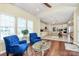 Sunroom featuring hardwood floors and lots of natural light adjoins open floorplan at 1618 Bay Meadows Nw Ave, Concord, NC 28027