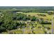Neighborhood aerial view with a pinpoint on the home's location amidst lush trees and greenery at 170 Wagon Wheel Way # 4, Salisbury, NC 28147
