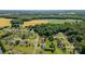 Aerial view of the property with surroundings, including nearby fields and mature trees at 170 Wagon Wheel Way # 4, Salisbury, NC 28147