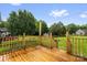 Large wooden back deck overlooks a lush, green lawn and fenced yard at 170 Wagon Wheel Way # 4, Salisbury, NC 28147