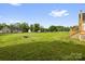 Expansive backyard featuring lush green grass, playground, and fire pit at 170 Wagon Wheel Way # 4, Salisbury, NC 28147