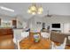 Open concept view of the dining area, kitchen, and living room with vaulted ceiling at 170 Wagon Wheel Way # 4, Salisbury, NC 28147