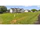 Classic ranch house on a spacious lot, complete with a lush lawn and traditional white facade at 170 Wagon Wheel Way # 4, Salisbury, NC 28147