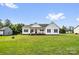 Traditional ranch home with a well-maintained lawn, front porch, American flag, and classic design at 170 Wagon Wheel Way # 4, Salisbury, NC 28147