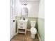 Bathroom with sage wainscoting and modern vanity at 1770 Windsor Dr, Lancaster, SC 29720