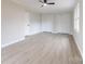 Bright bedroom featuring a ceiling fan, plank flooring, and double closets for ample storage at 1770 Windsor Dr, Lancaster, SC 29720
