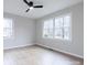 Bedroom with light hardwood floors, neutral paint, and large windows offering ample natural light at 1770 Windsor Dr, Lancaster, SC 29720