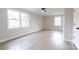 Empty room featuring neutral paint, two windows, and wood-look floors at 1770 Windsor Dr, Lancaster, SC 29720