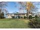 Charming single-story home with a manicured lawn, mature trees, and inviting front porch at 1770 Windsor Dr, Lancaster, SC 29720